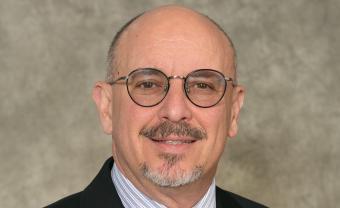 Headshot of Bert Carter. He wears glasses!