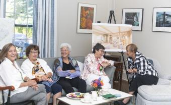 Members of Lesley's Class of 1972 gather at President's Steinmayer's house.