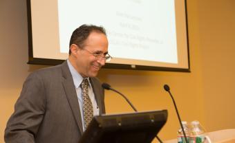 Dan Losen speaking at podium