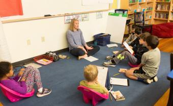 ellie brennan with a group of elementary students