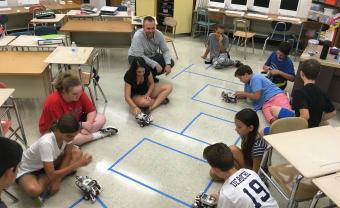 elementary Robotics class testing their robots