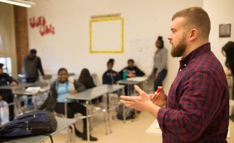 male teacher in front of the classroom