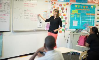 High school teacher in front of the classroom 