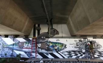 large mural on highway underpass