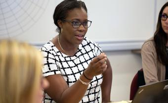 Three students participating in class discussion