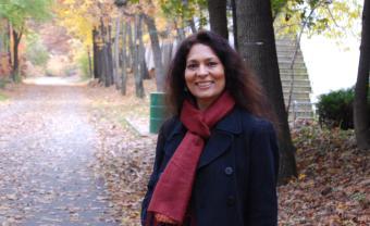 mcchabra standing outside on a paved path in the fall
