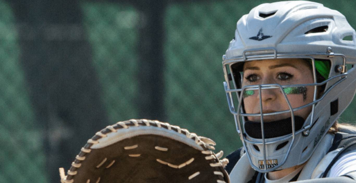 Lesley softball athlete catching ball