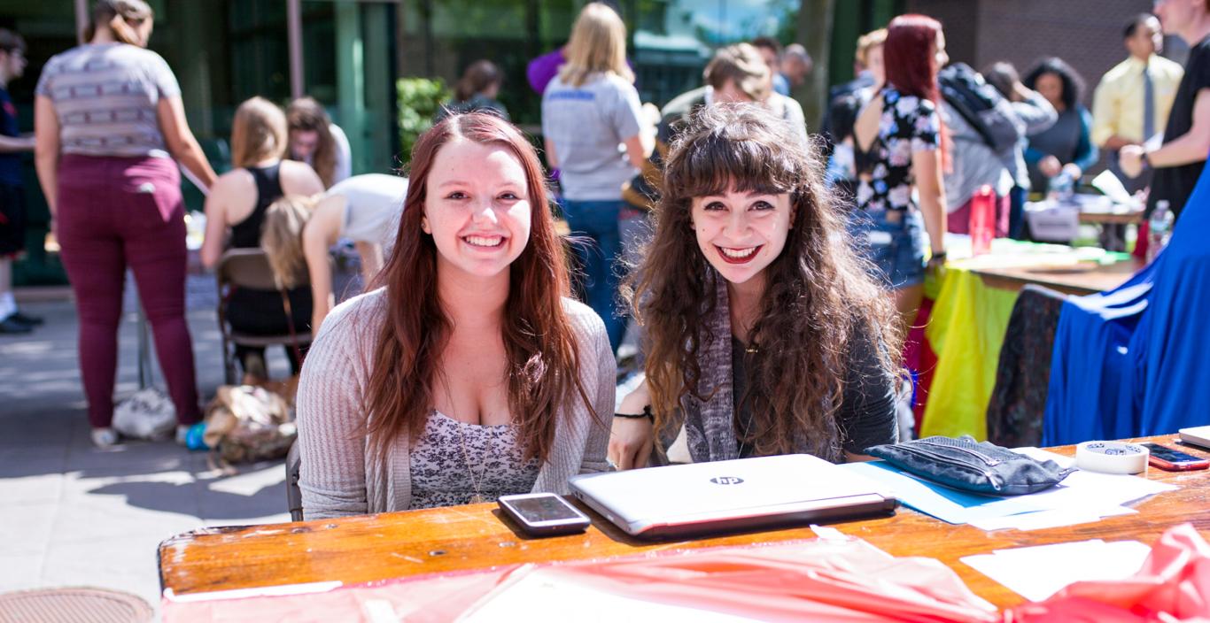 two students at the club and organizations fair