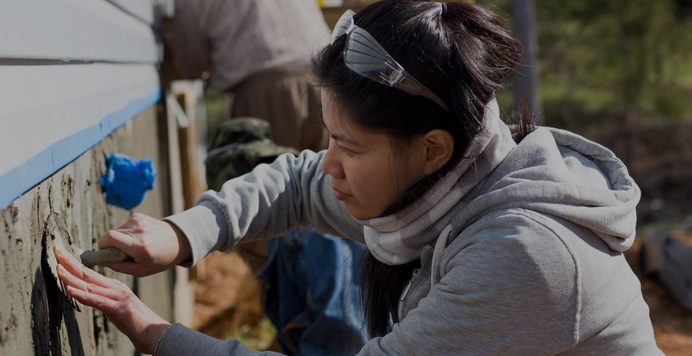 Lesley University fine arts student working on outdoor art installation project