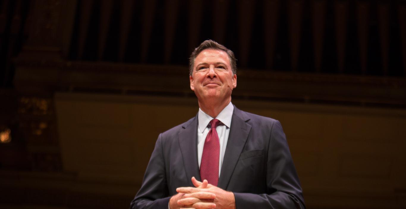 James Comey standing on the Symphony Hall stage