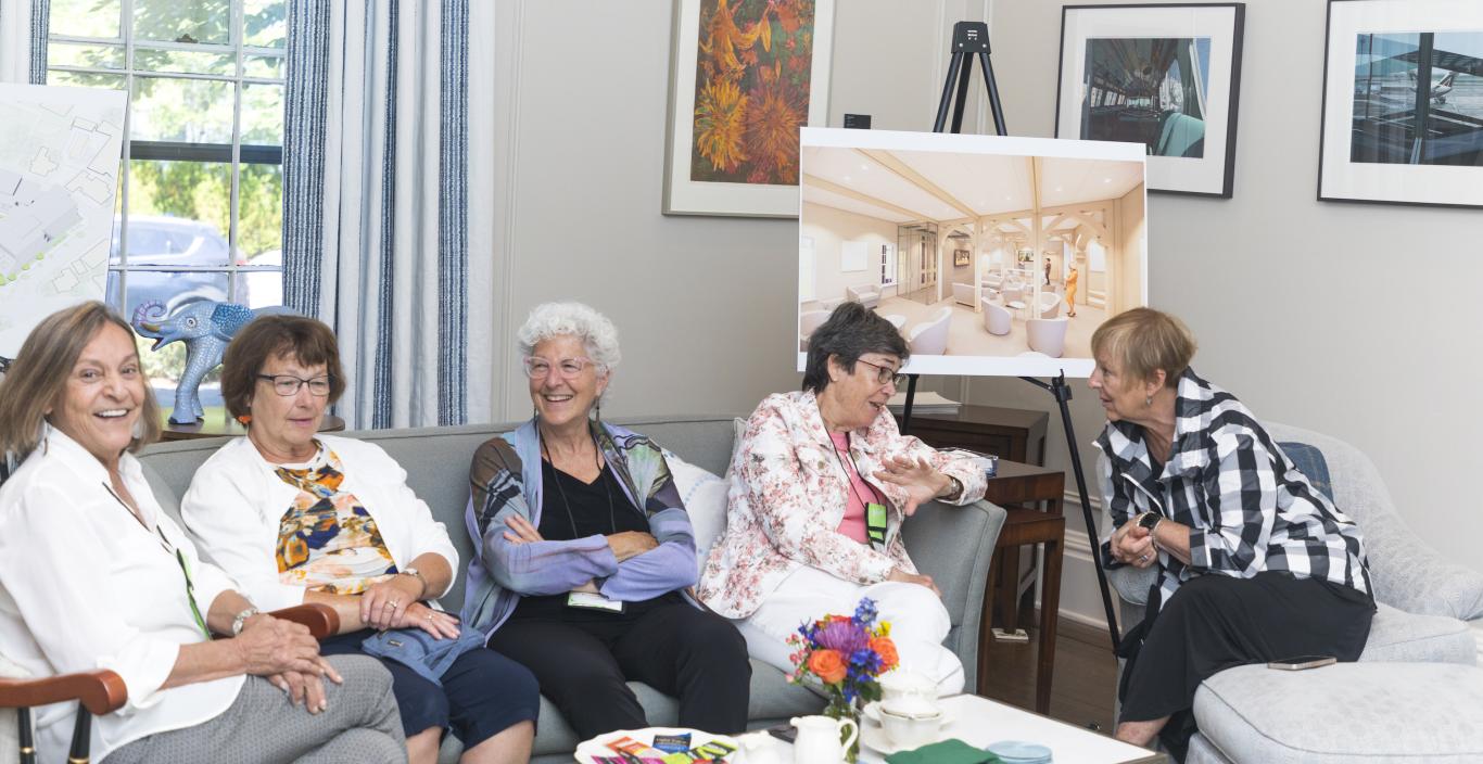 Members of Lesley's Class of 1972 gather at President's Steinmayer's house.