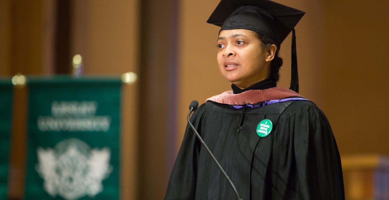 Professor Danielle Legros Georges recites an original poem at President Weiss's inauguration.