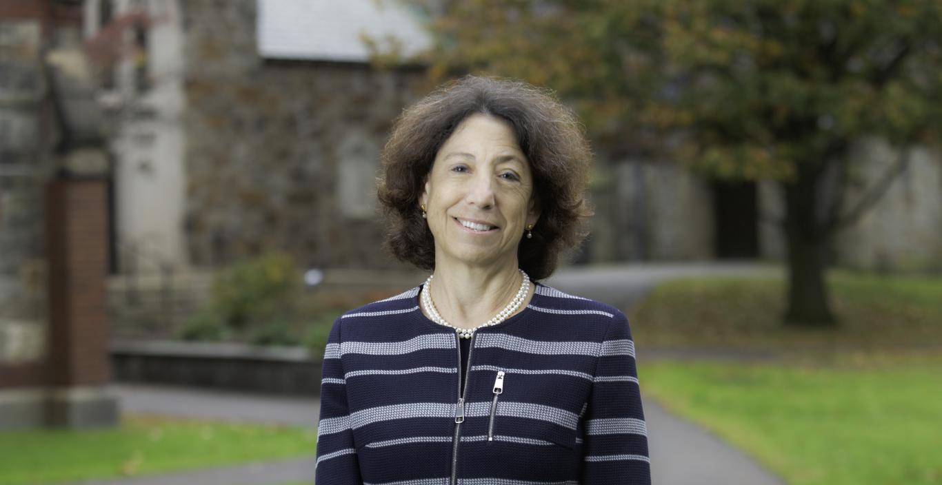 President Steinmayer wearing a striped blazer on Brattle Campus