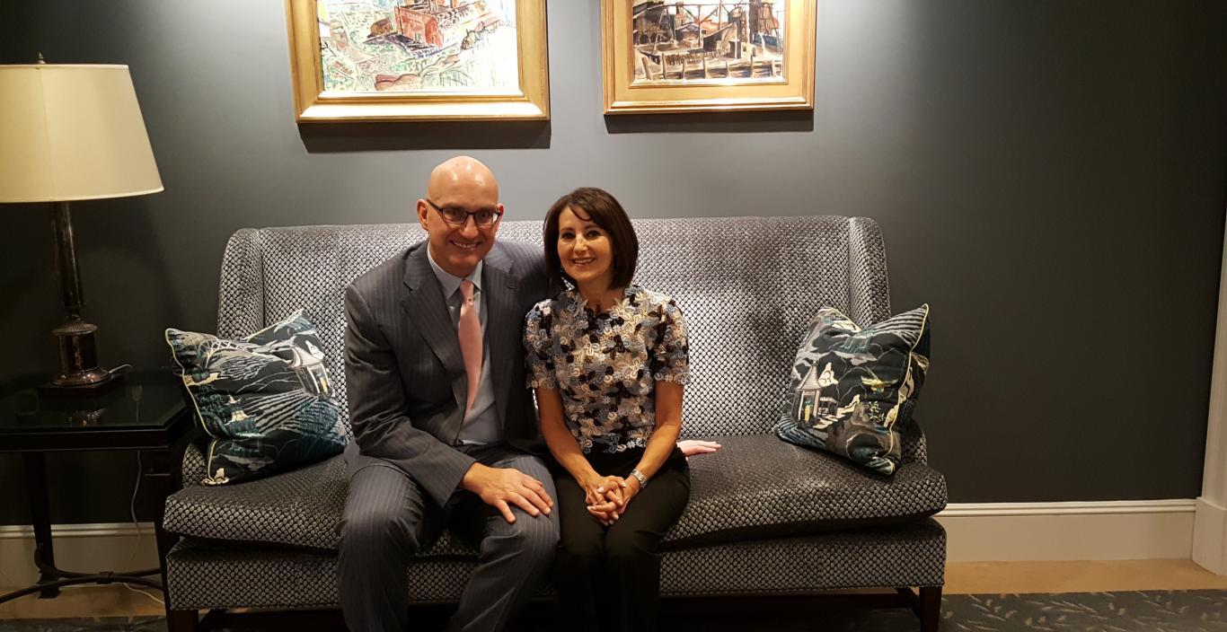 Chris Gaffney and Karen Kames sit together on a couch.