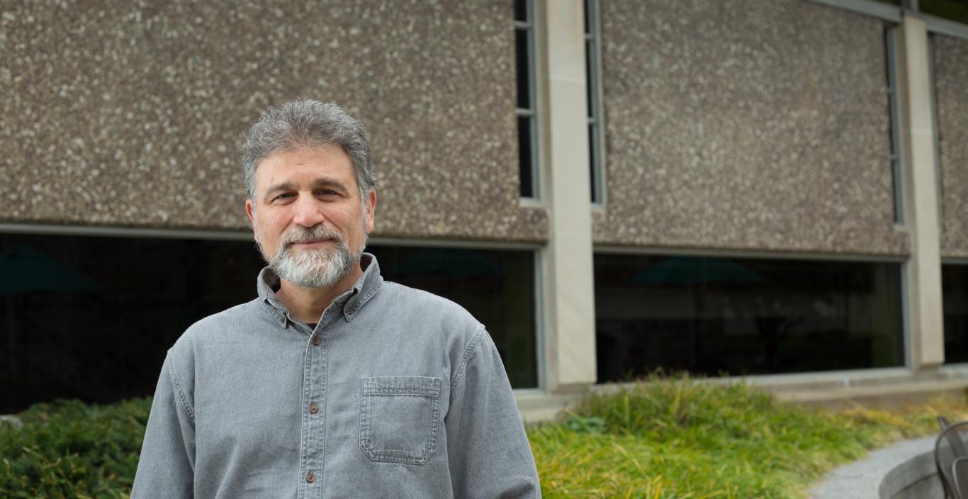 Professor Mitchell Kossak in front of Sherrill Library.