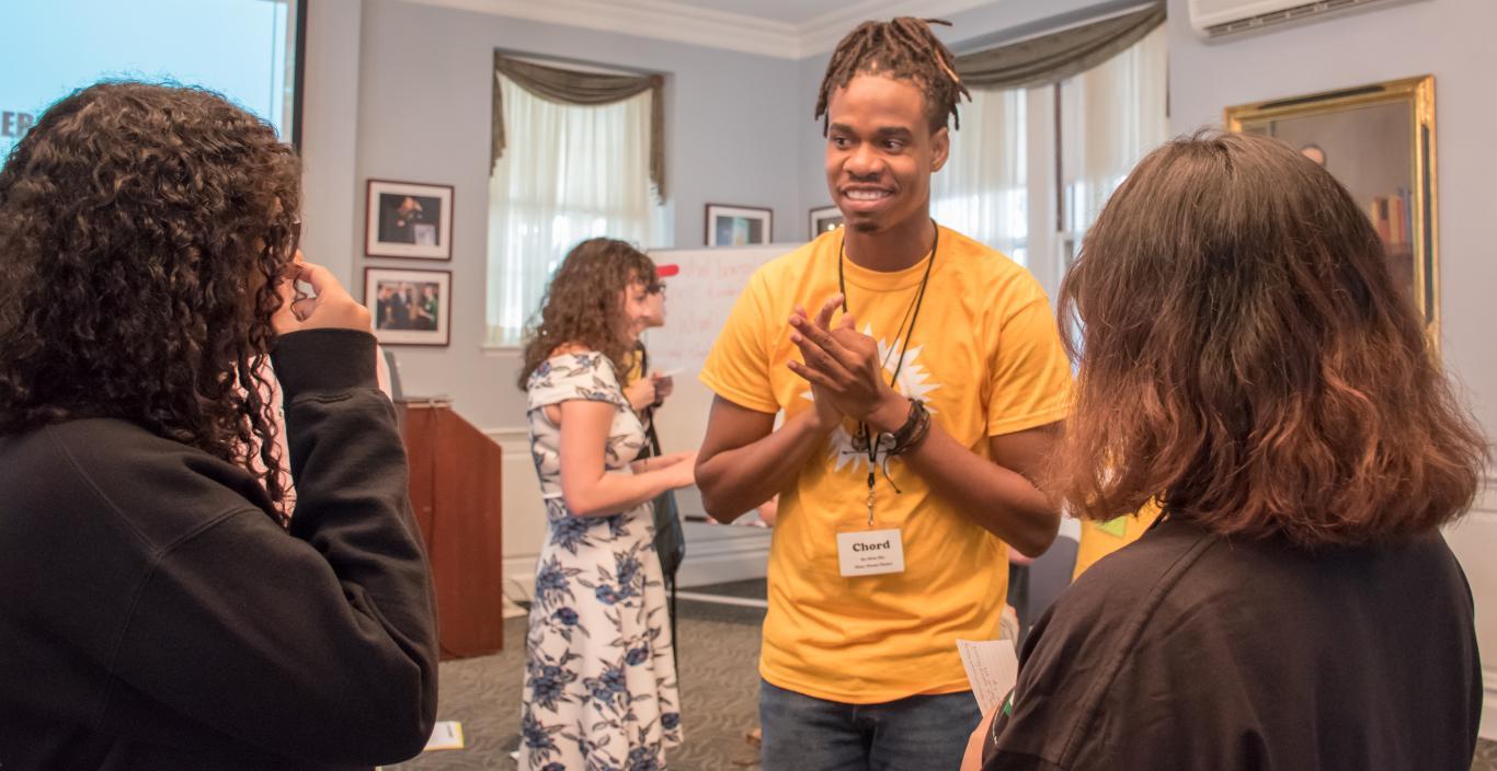 Senior Chord Shariffe speaks with freshmen at Student Transition Weekend.