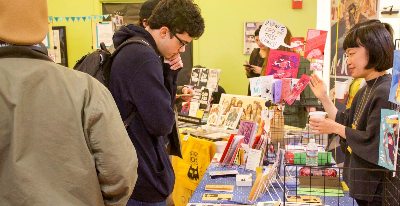 Students and artists presenting at a comic book convention