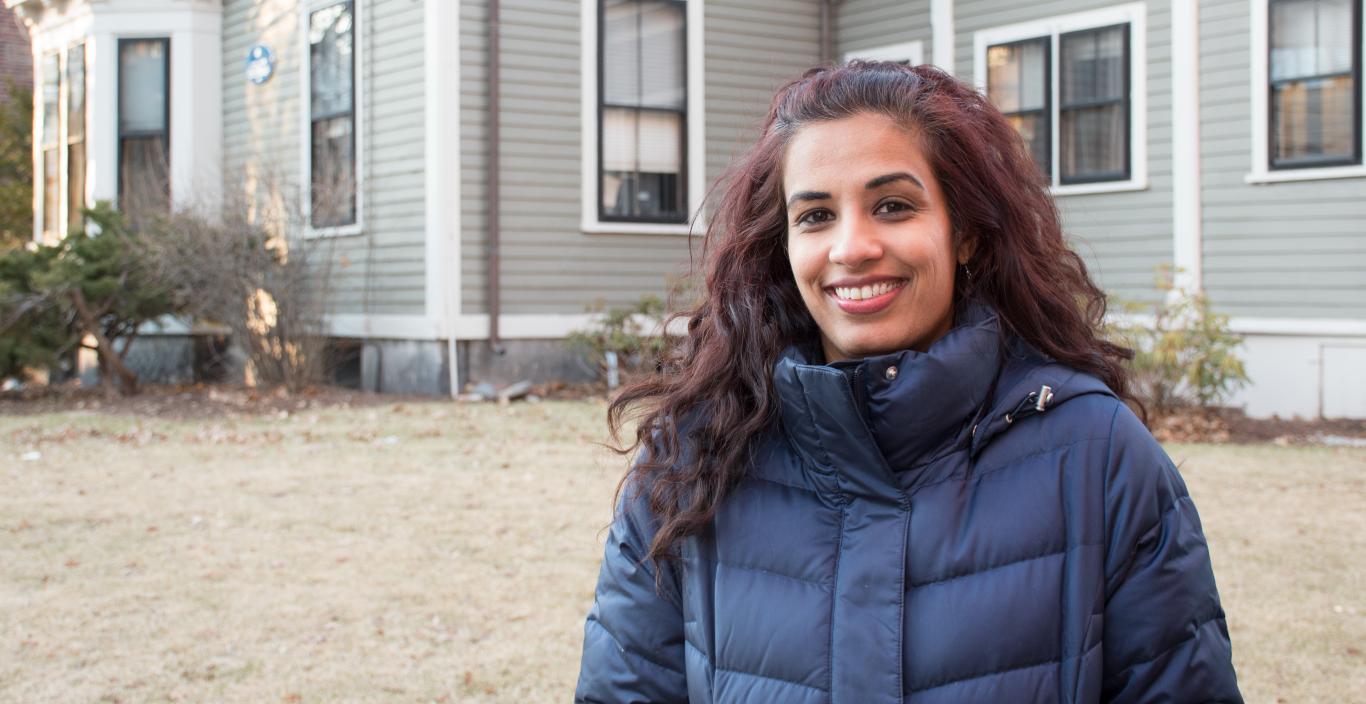 Outdoor shot of Mariya Taher in front of 29 Everett (founder's house at Lesley).