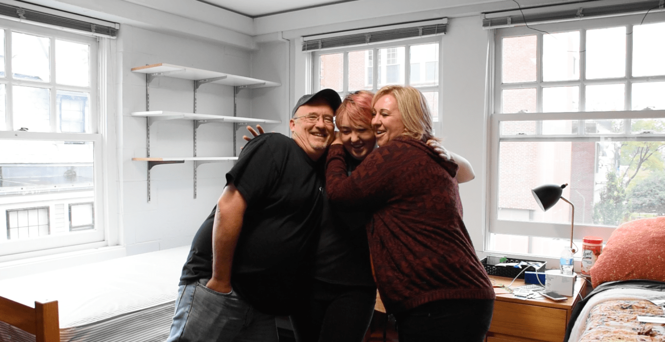 Family hugs on move-in day.