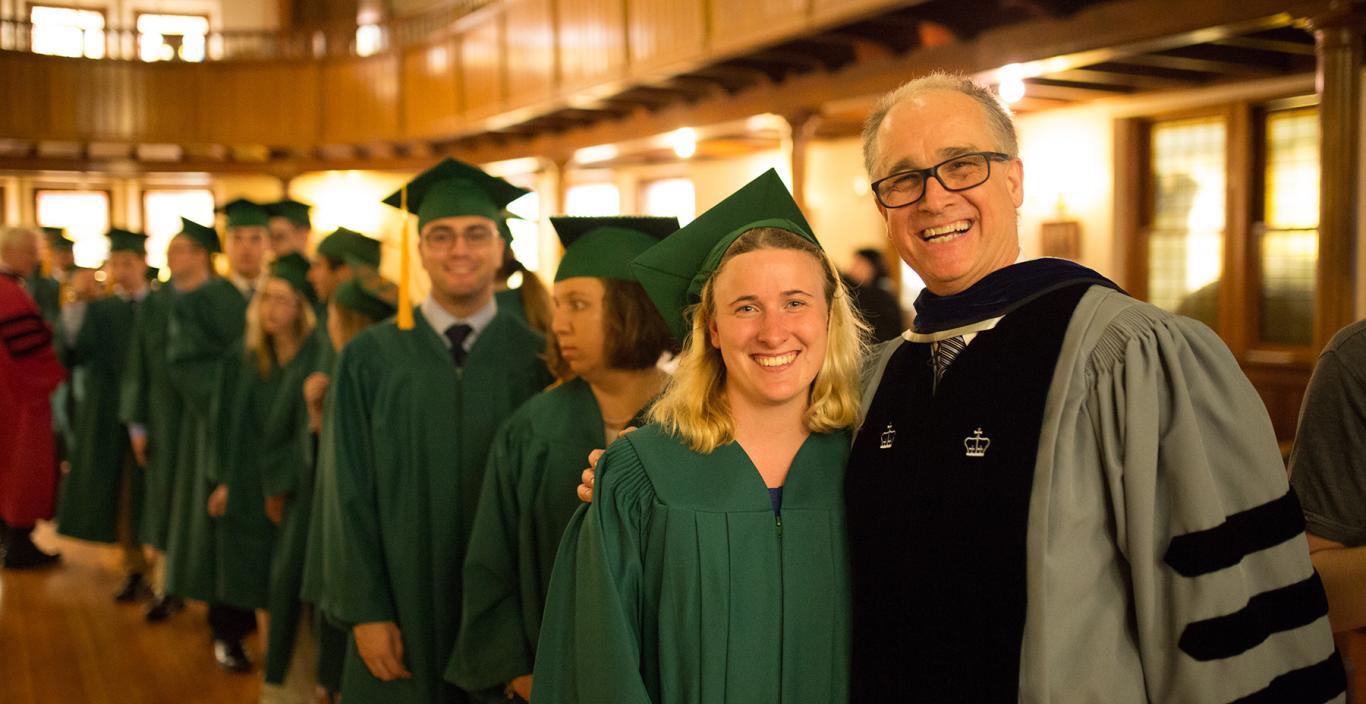 Graduates line up behind Threshold Director Ernst VanBergeijk before they process into the ceremony.