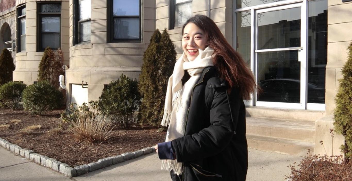 Yuka Chen standing outside with a building behind her.
