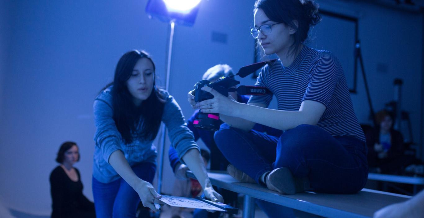 Students setting up lights and camera