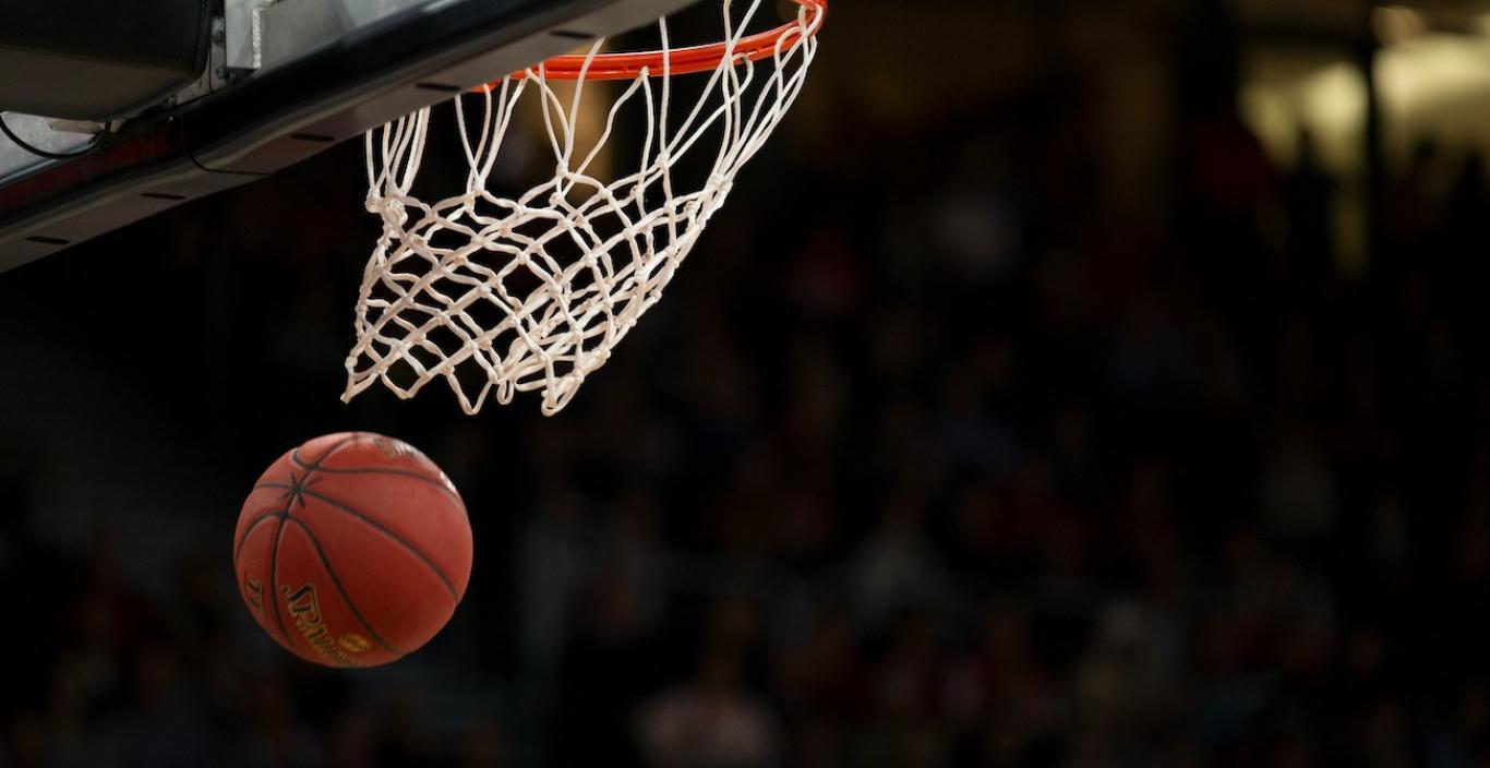 Basketball going in hoop