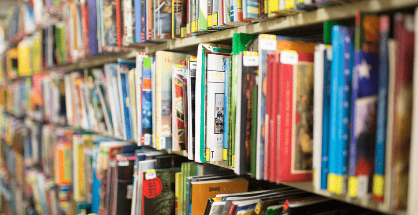 Colorful childrens books on a shelf