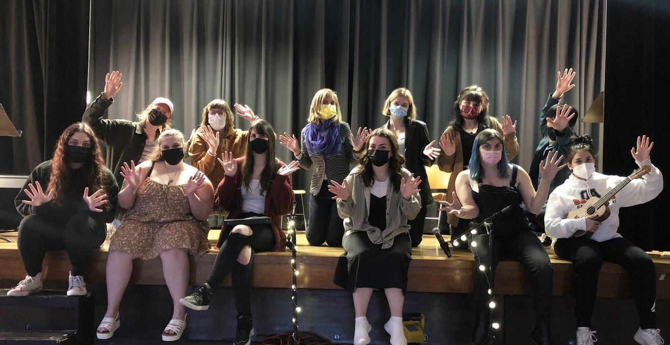Photo of cabaret cast posed on the Washburn Auditorium stage