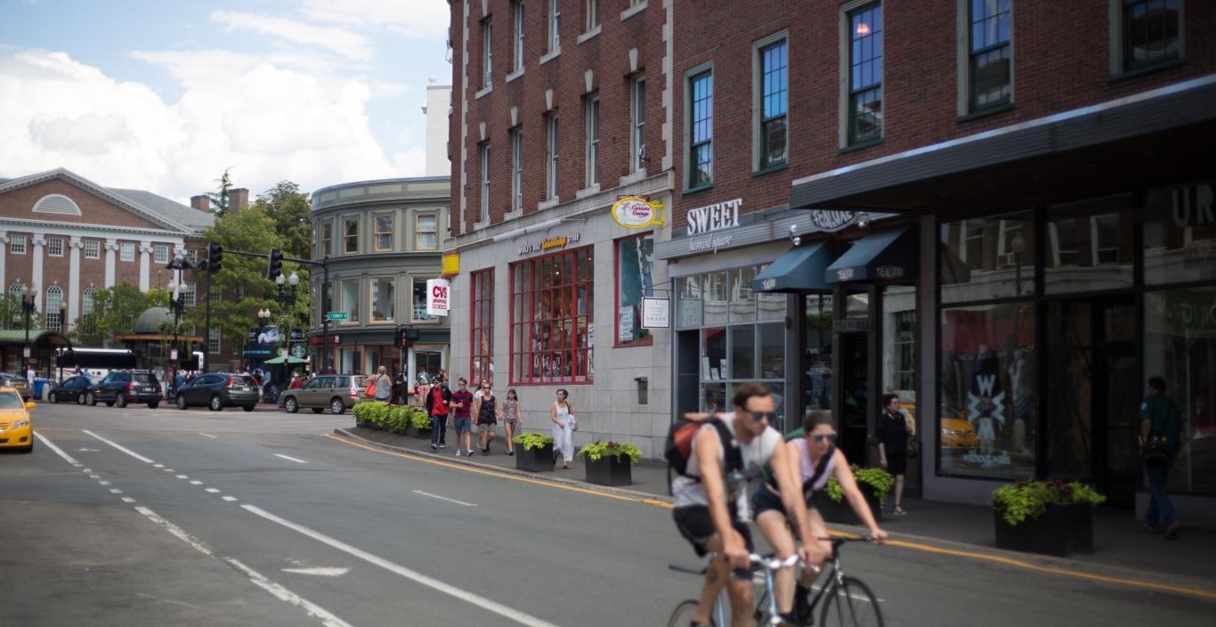 Bike rider in Harvard square on Massachusetts Avenue