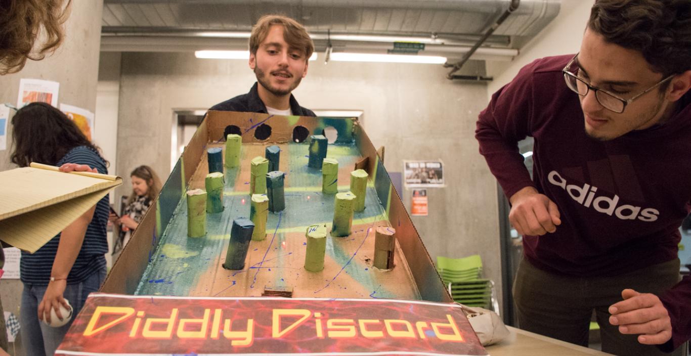 People look at the Plinko-esque "Diddly Discord."