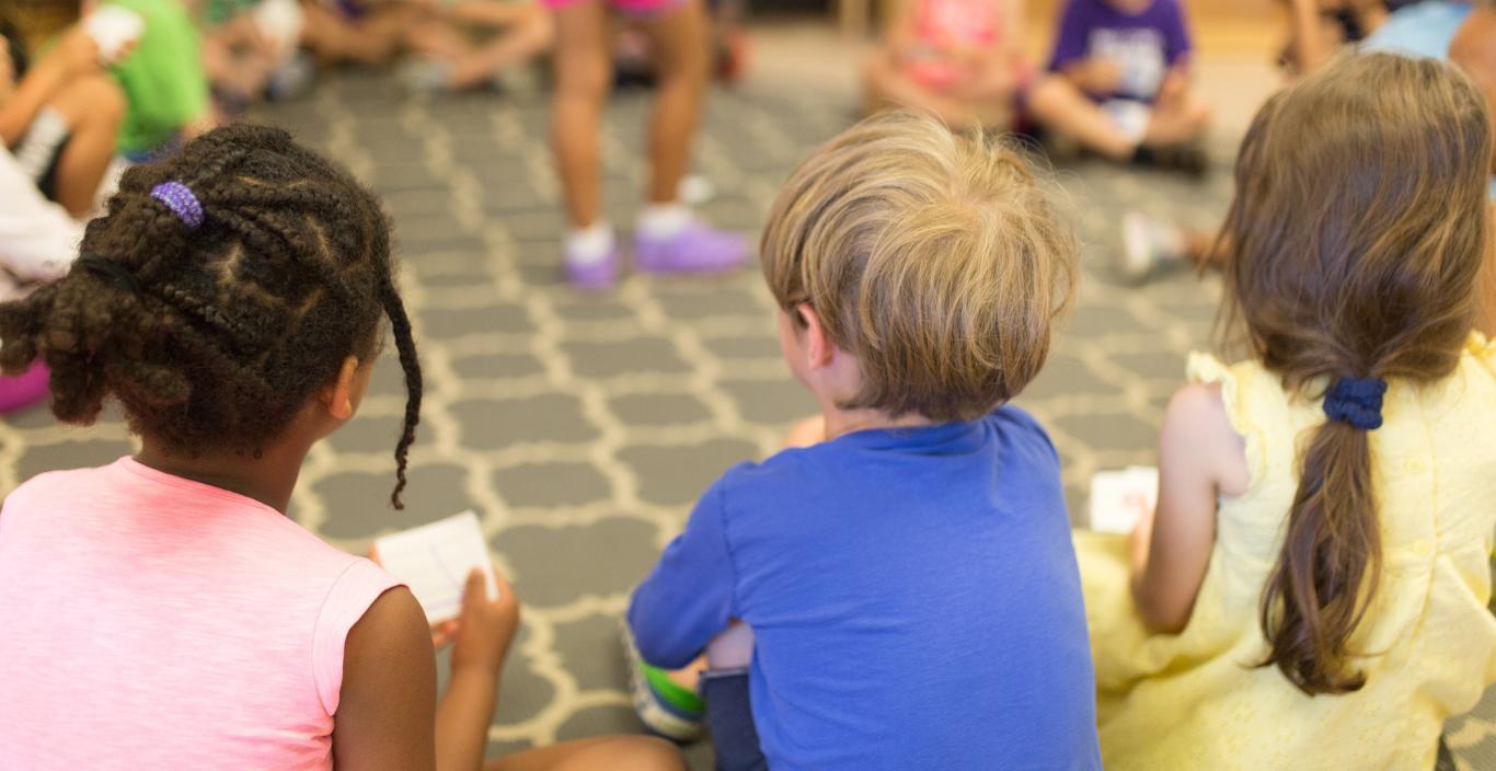 Children sitting in a circle on the floor