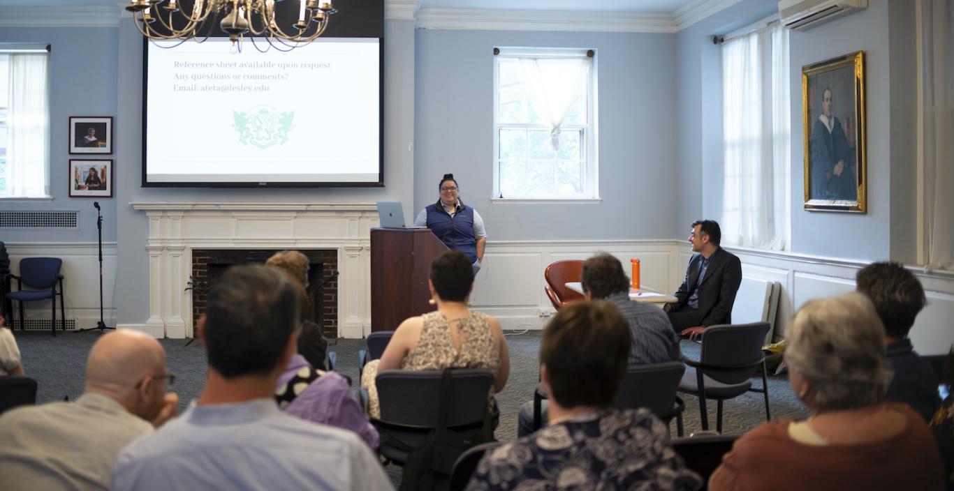 Ameilia Teta presenting project in front of audience at Alumni Hall