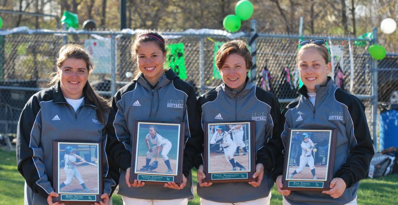 Molly Sarson, Jessica Guevara, Emily Mangiaratti and Rian Powers hold their softball plaques