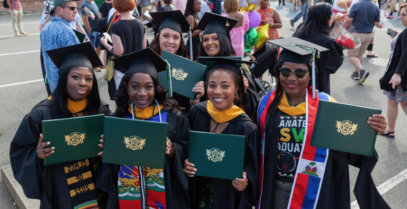 MSW graduate cohort in academic regalia