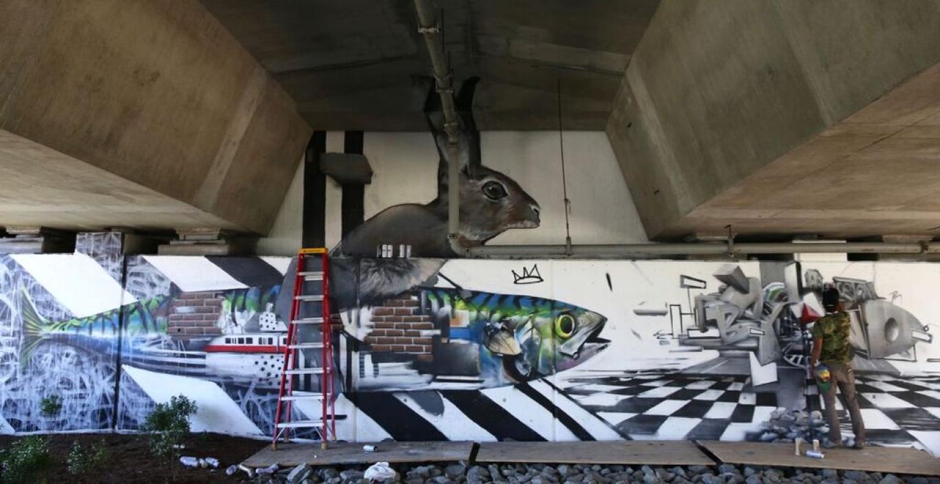 large mural on highway underpass