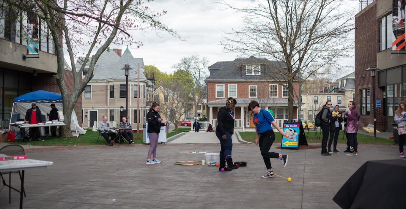 Students outside on the quad playing games at the Quadfest carnival