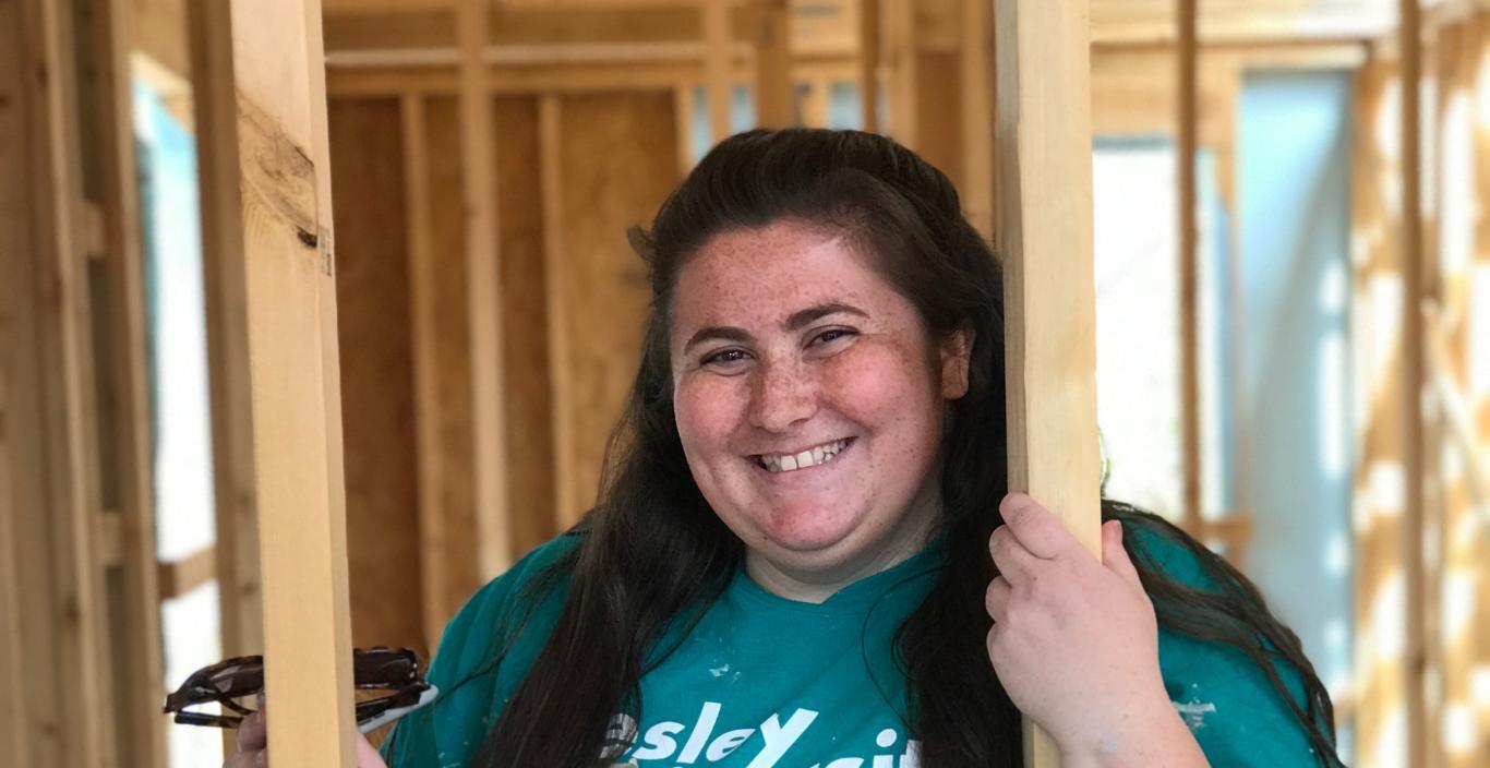 Rachel DiGangi inside a halfway built Habitat for Humanity home in North Carolina.