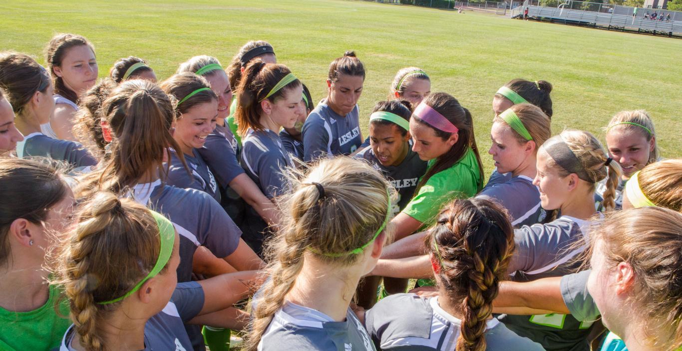 women's soccer team huddle