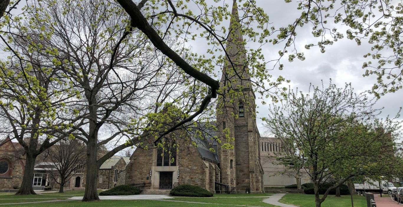 St. John's Chapel with tree limbs in the forefront.