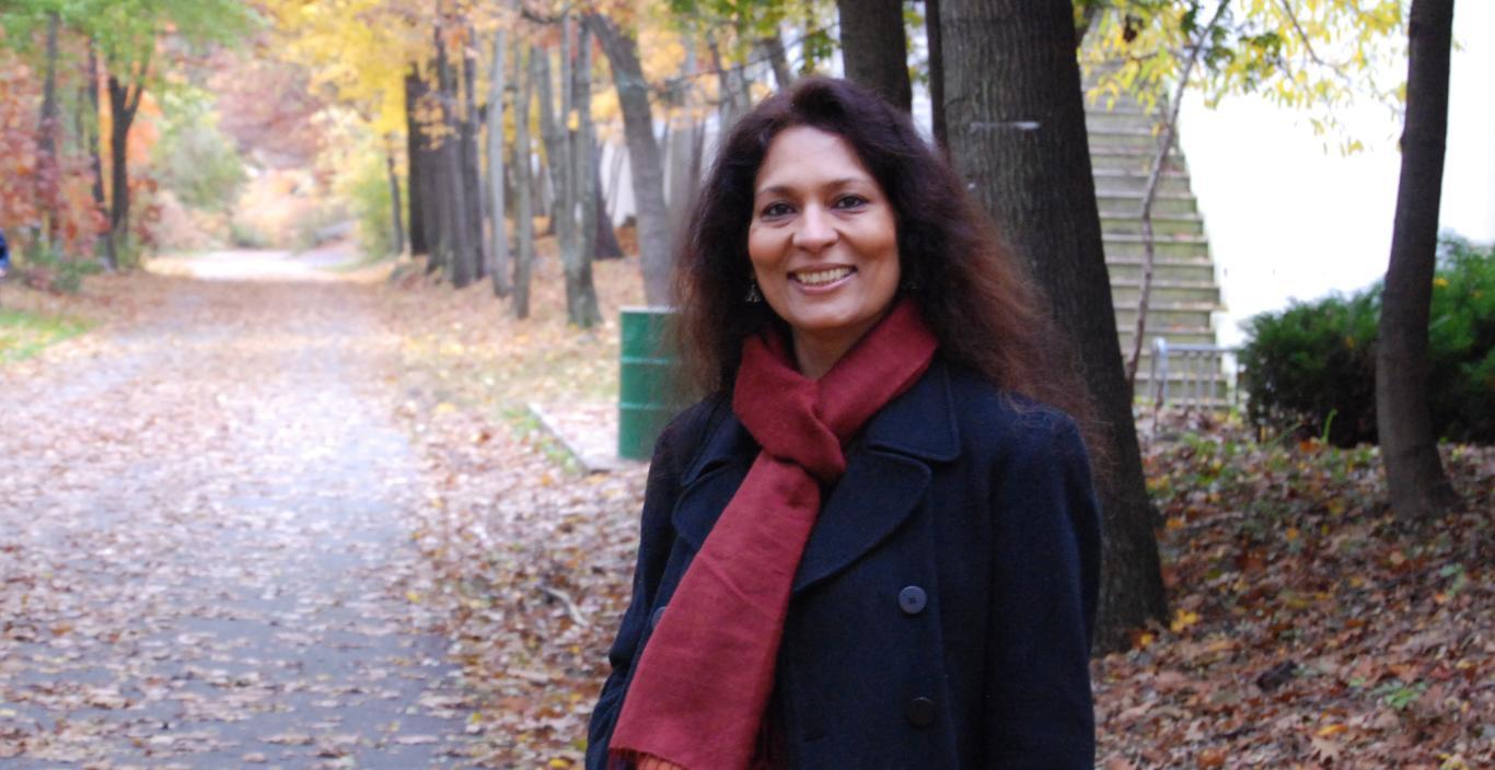 mcchabra standing outside on a paved path in the fall