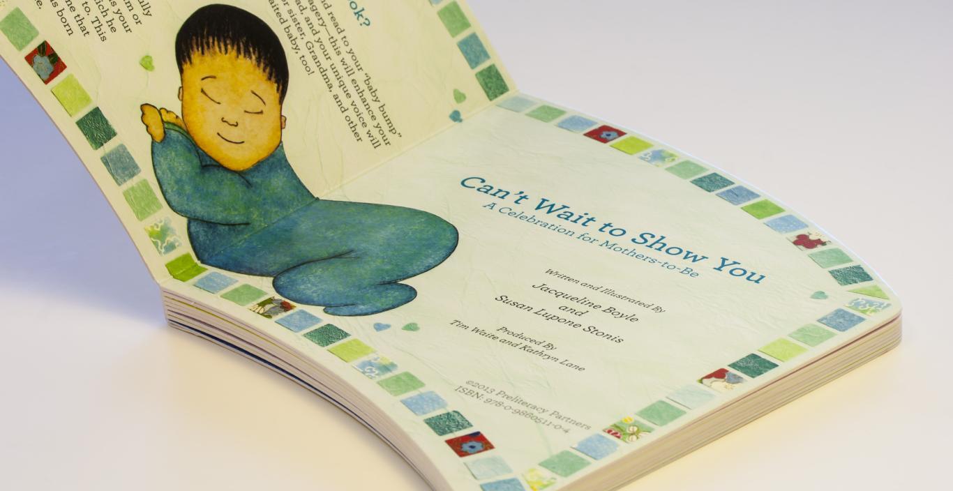 Book open to a page with an illustration of a baby.