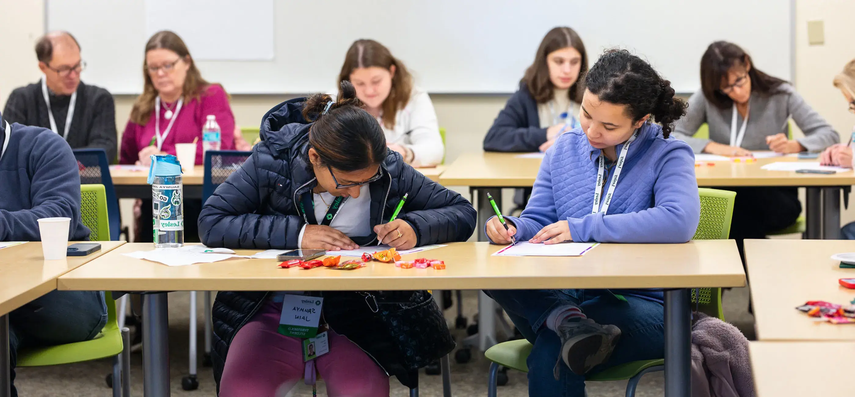 students writing at table