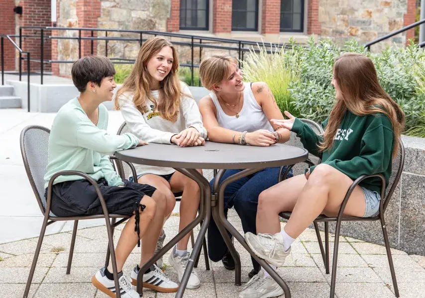 students at table laughing