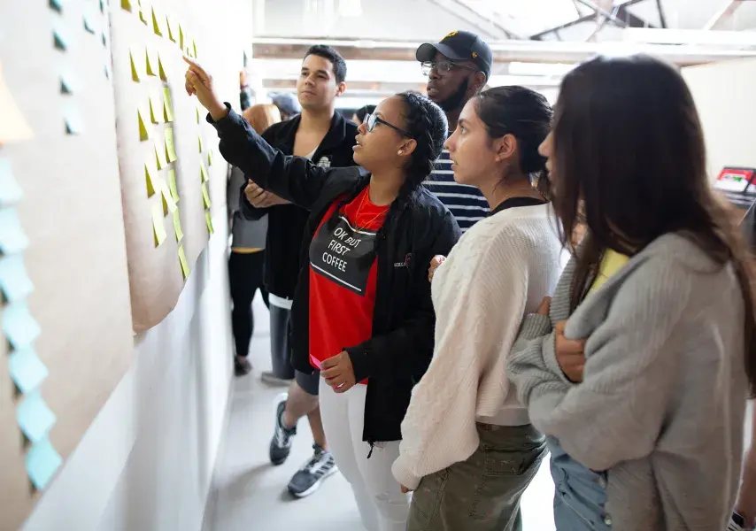 students working on a board