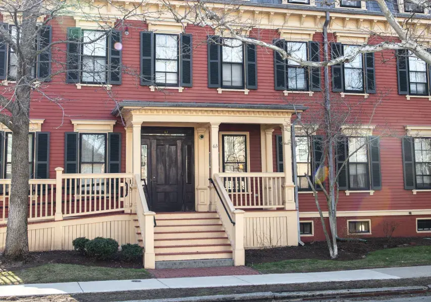 Photo of Wendell House with red paint and yellow trim