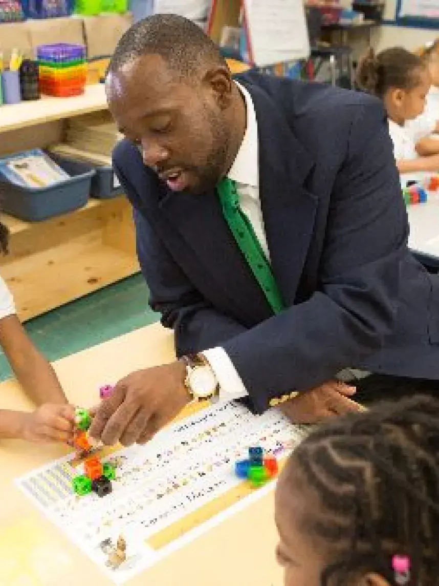 Master's of education student working with child