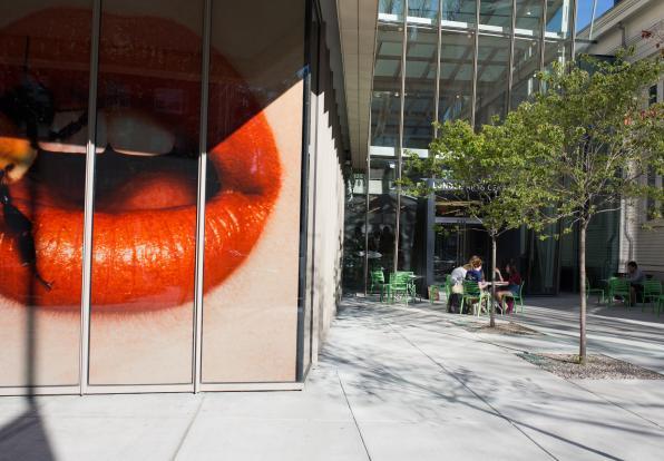 A larger than life Irving Penn photo of red lips taken from outside Lunder Art Center
