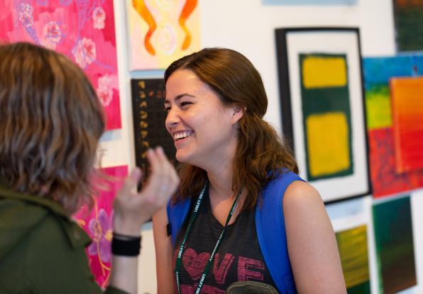 Two Students Speaking with Bright Background