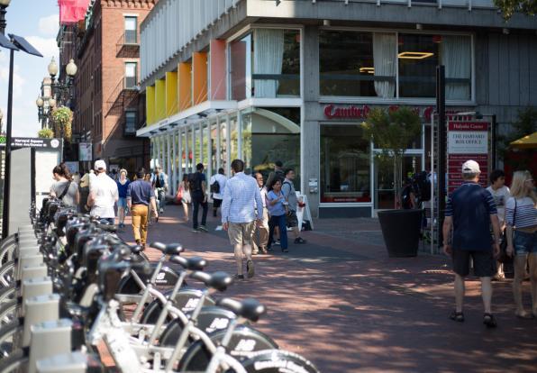 man walking in harvard square, cambridge